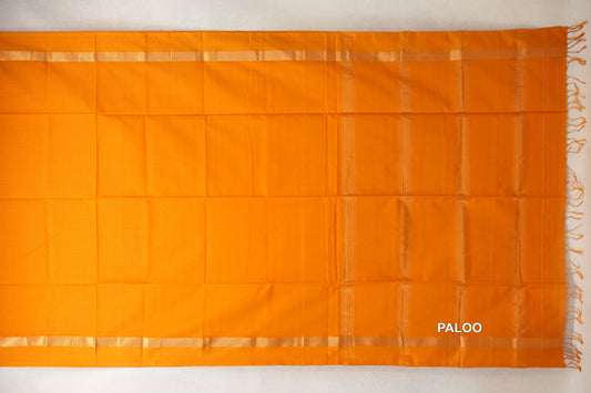 Mango yellow Maheshwari silk-cotton saree pallu spread flat, with subtle vertical stripes, narrow woven borders and tassels along one end.