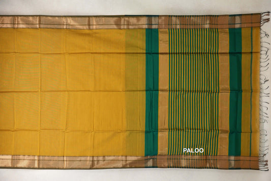 Maheshwari silk-cotton saree spread flat, with a mustard yellow body, deep emerald green borders and a striped green-and-yellow pallu on the right.