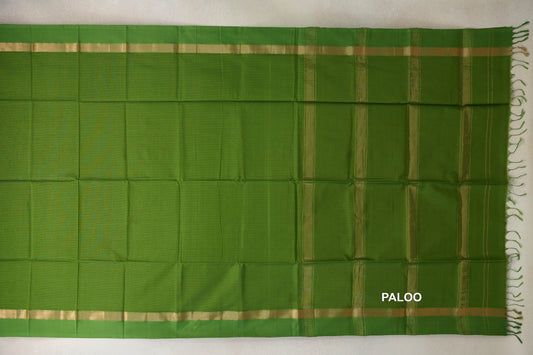 Leaf Green Maheshwari silk cotton saree spread out, with a plain body, gold-striped borders and a striped pallu with fringe on the right.