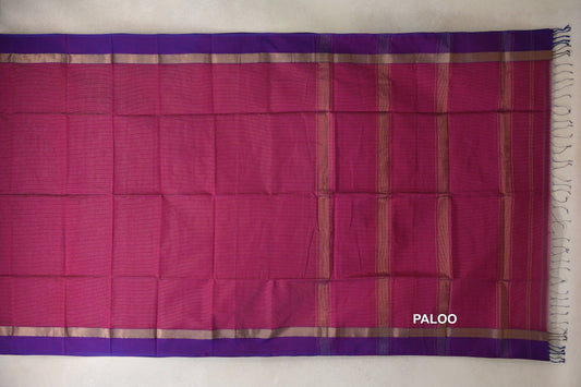 Deep Rani Pink Maheshwari silk cotton saree spread flat, showing its striped pallu, violet purple borders with gold-toned bands, and end tassels.