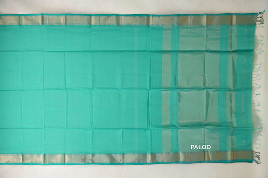 Turquoise green Maheshwari silk cotton saree spread flat, showing a plain body, shimmering borders and a striped pallu with tassels.