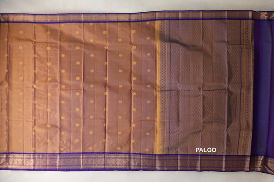 Unfolded lightweight Kanchipuram silk saree with small gold motifs on the body, violet purple borders and a lattice-patterned pallu.