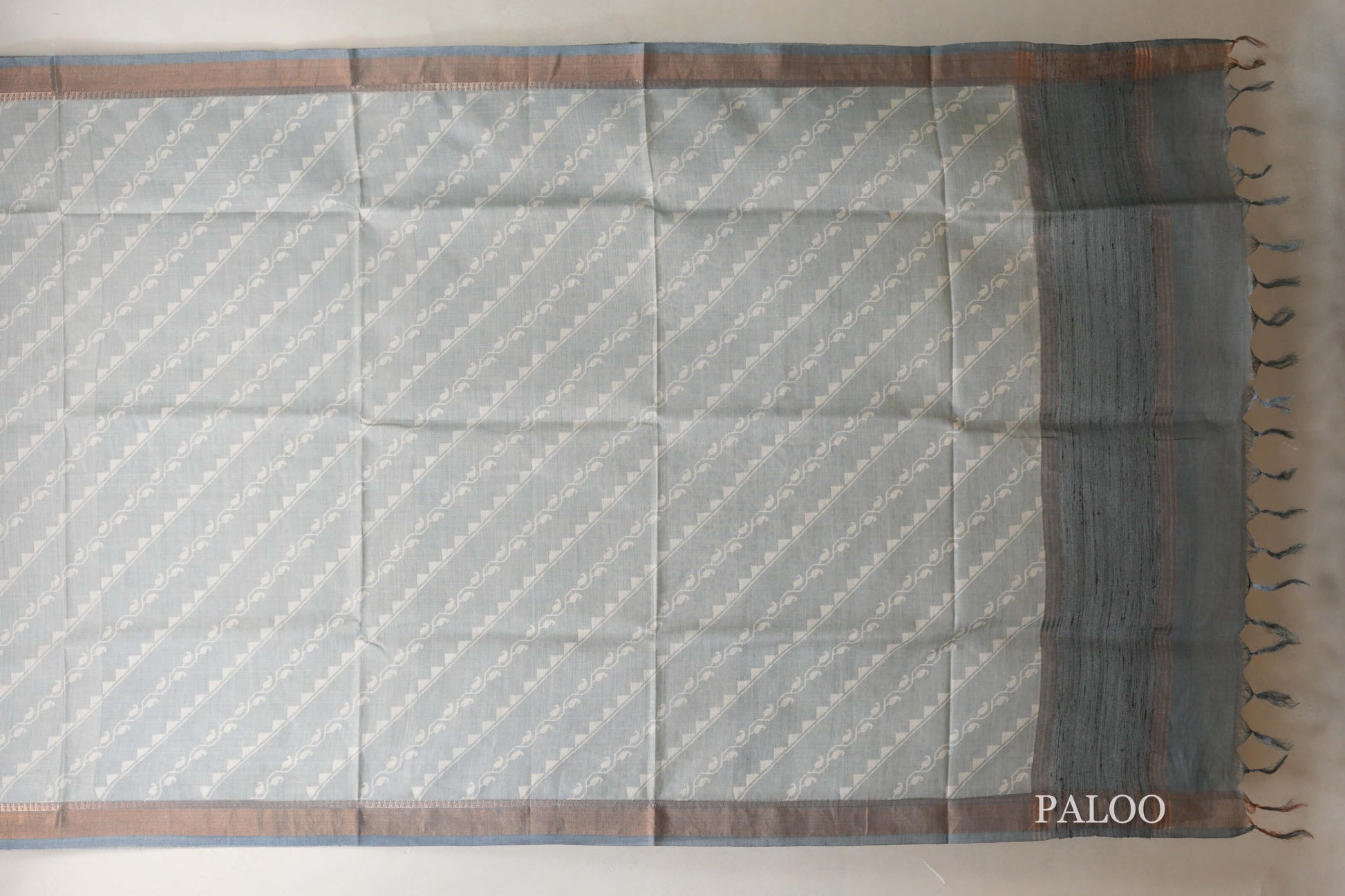 Pastel bluish grey with Dark Bluish Grey Borders Bhagalpur Tussar silk saree paloo