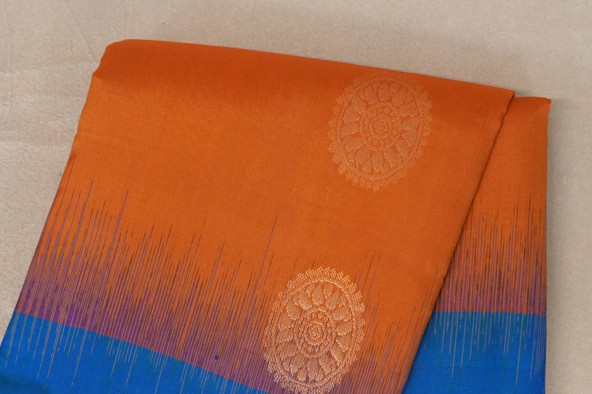 Burnt Orange with Peacock Blue Borders Light Weight Kanjivaram Silk Saree body