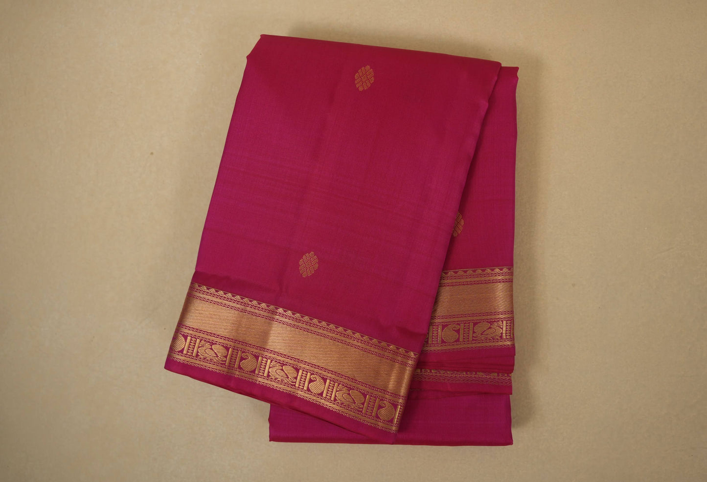 Folded pink light weight kanchipuram silk saree 
