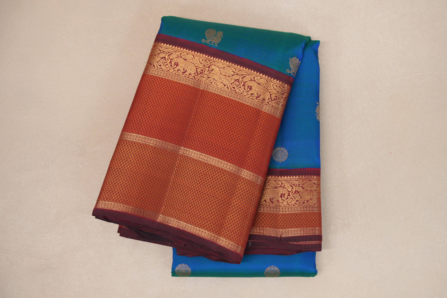 folded Peacock Blue with Multi Color Borders Heirloom Kanjivaram Silk Saree