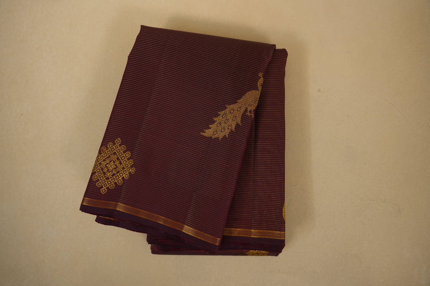 folded burgundy maroon vintage kanjivaram silk saree