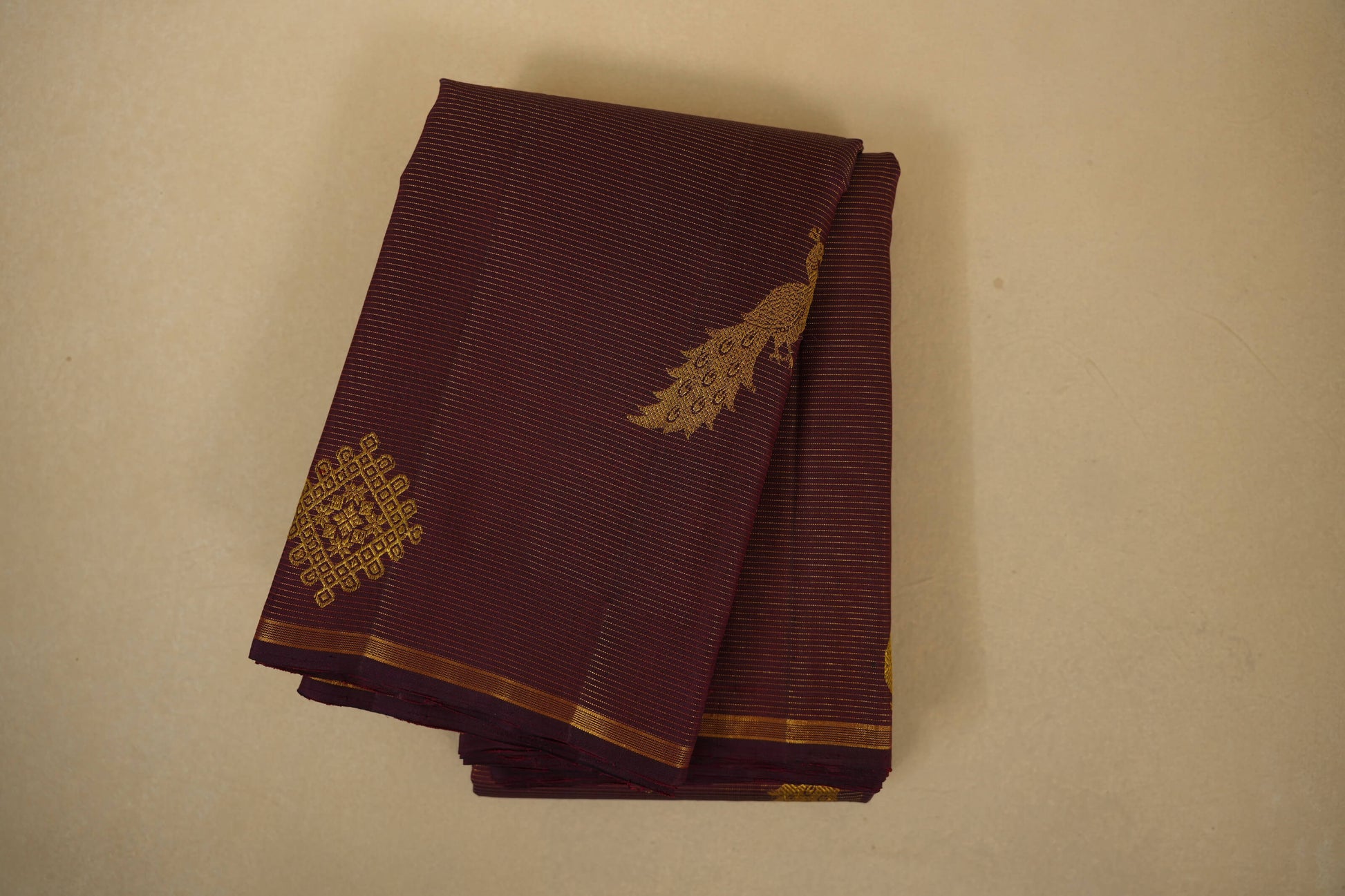 folded burgundy maroon vintage kanjivaram silk saree