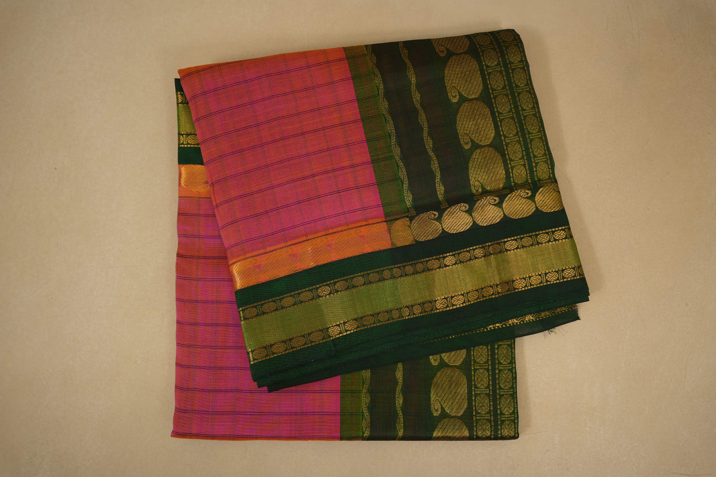 folded Pinkish orange vintage silk cotton saree