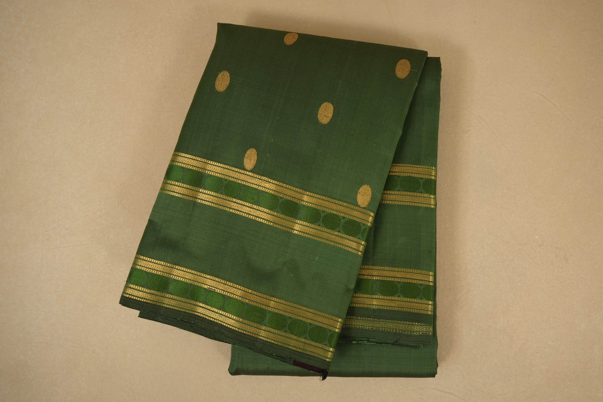 Moss green folded vintage kanjivaram silk saree