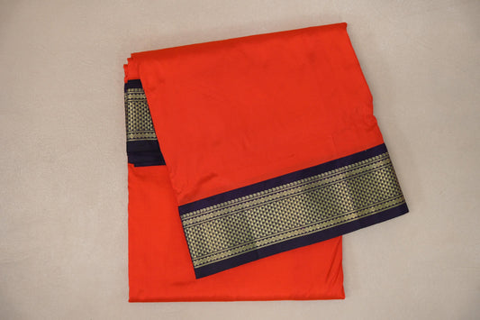 folded Reddish Orange Ten Yards Silk Cotton saree