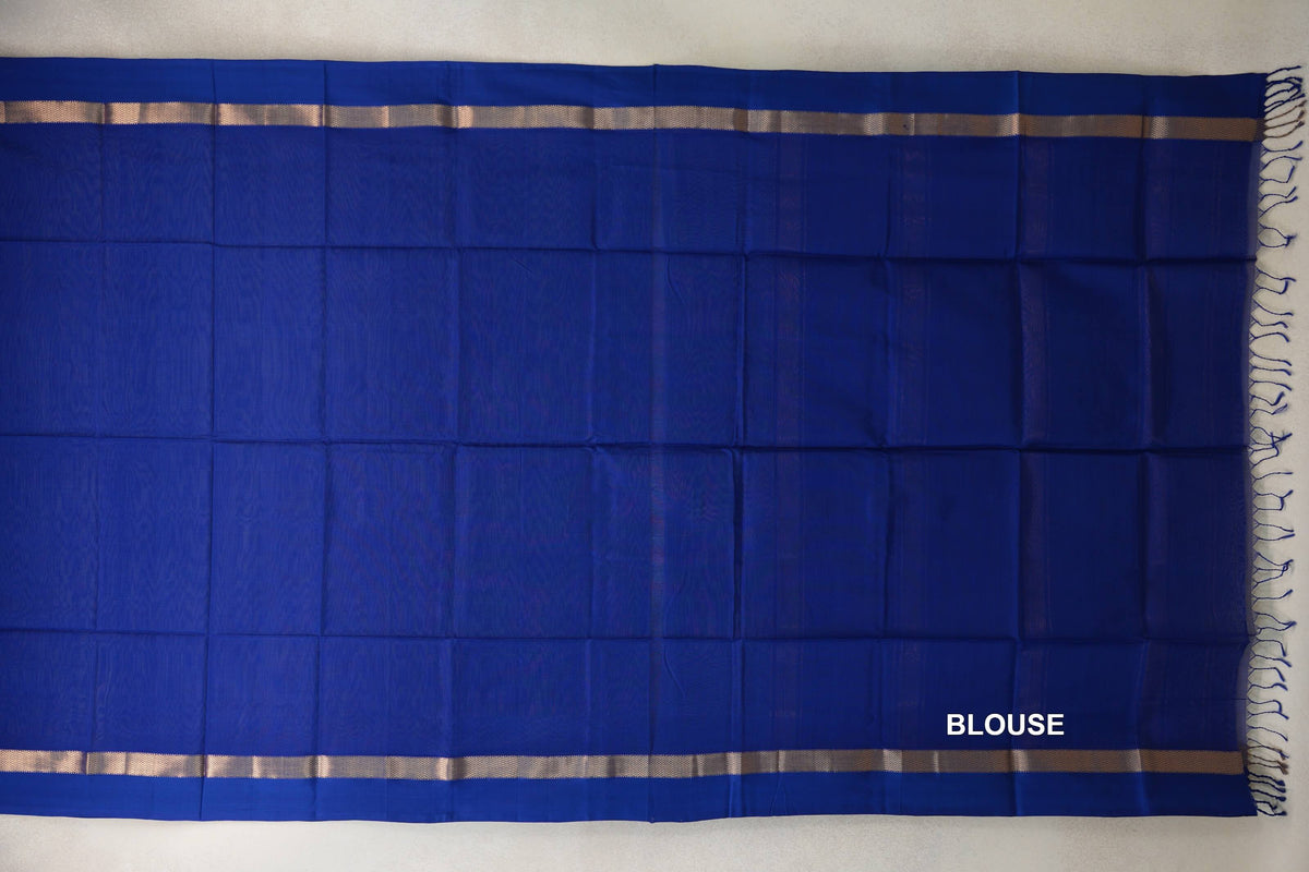 Deep Royal Blue Maheshwari silk cotton blouse fabric laid flat, with narrow gold-toned borders and blue tassels along one edge.