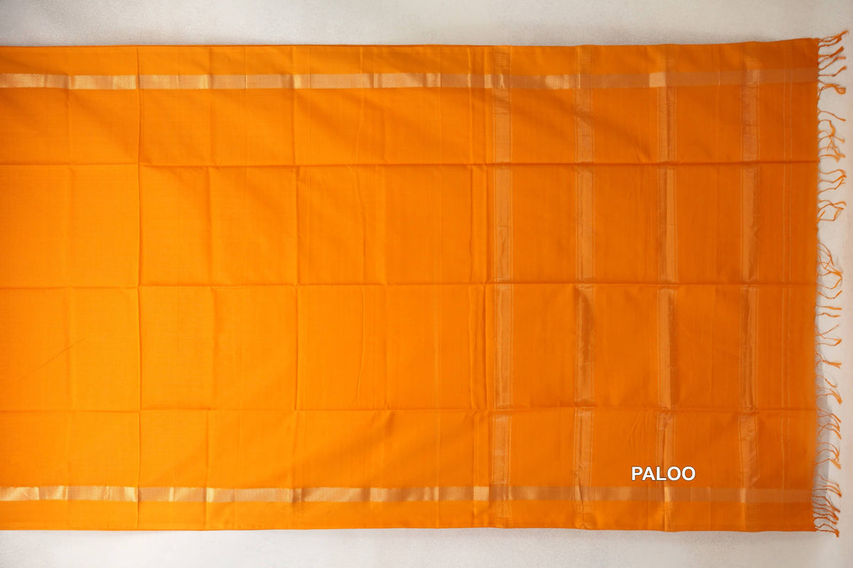 Mango yellow Maheshwari silk-cotton saree pallu spread flat, with subtle vertical stripes, narrow woven borders and tassels along one end.