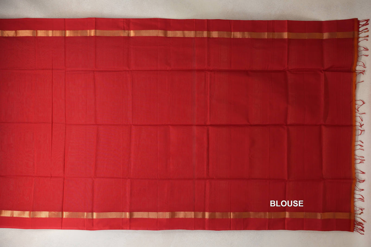 Vermilion red Maheshwari silk cotton blouse piece laid flat, with narrow gold-patterned borders and red tassels at one end.