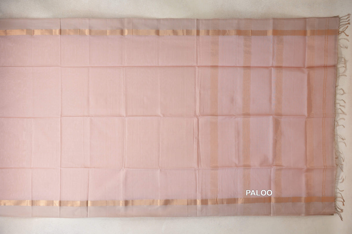 Blush pink Maheshwari silk cotton saree pallu laid flat, with light sandal beige borders, vertical stripes and tassels at the end.