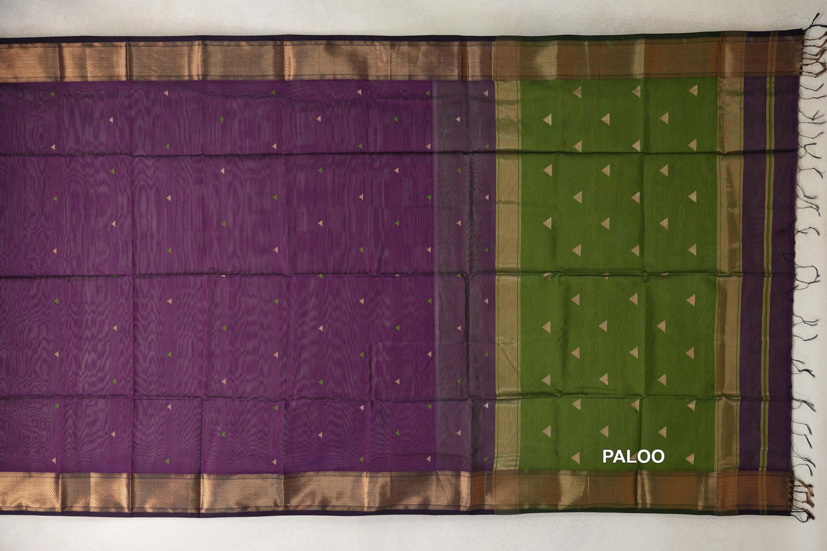 Deep Purple Maheshwari silk cotton saree laid flat, with small triangle motifs, zigzag-patterned borders and an Olive Green pallu with tassels.