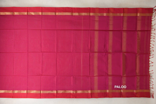 Spread-out Maheshwari silk cotton saree with a bright rani pink body, deep rani pink borders, gold-toned bands and a striped pallu with tassels.