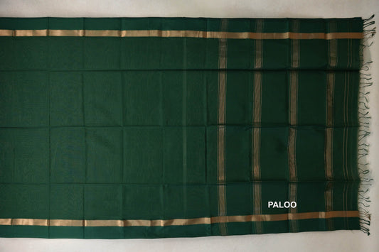 Deep bottle green Maheshwari silk cotton saree laid flat, showing a plain body, gold-toned borders, a striped pallu and tassels.