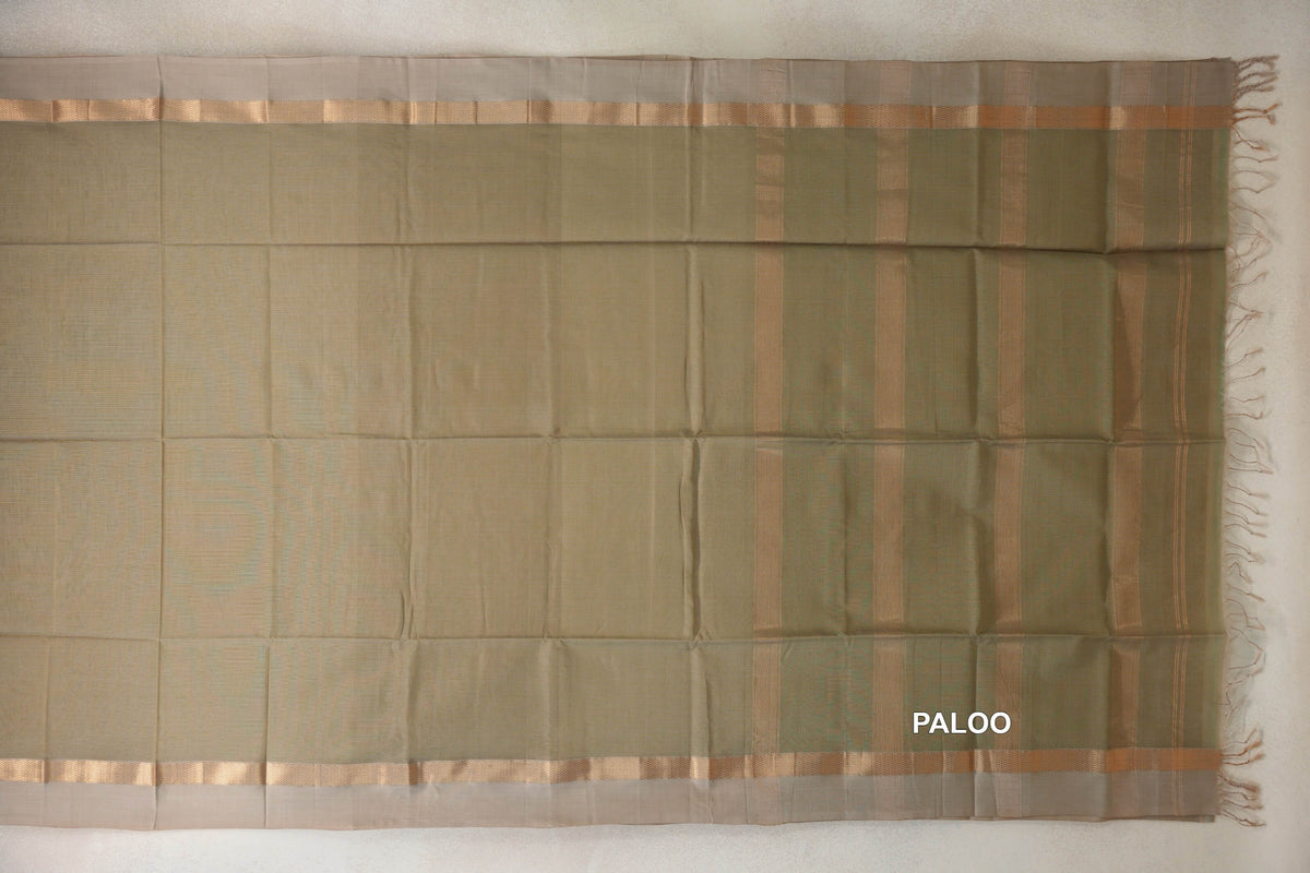 Light olive green Maheshwari silk cotton saree laid flat, with light beige borders, a striped gold zari pallu and tassels.