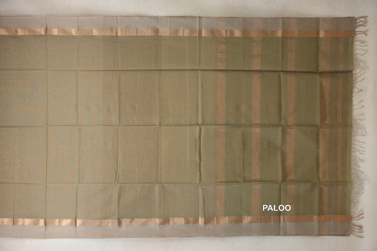 Light olive green Maheshwari silk cotton saree laid flat, with light beige borders, a striped gold zari pallu and tassels.