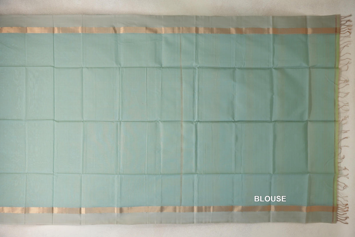 Sea green Maheshwari silk cotton blouse fabric laid flat, with light sandal beige striped borders and tassels at one end.