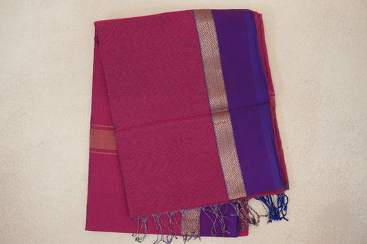 Folded Deep Rani Pink Maheshwari silk cotton saree with fine stripes, a Violet Purple border, zigzag-patterned band and tasselled edge.