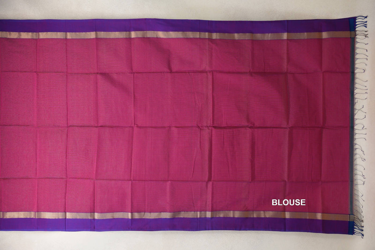 Blouse section of a Deep Rani Pink Maheshwari silk cotton saree laid flat, with violet purple borders, narrow gold-toned bands and end tassels.