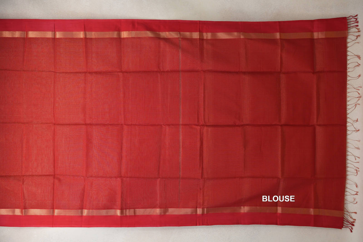 Red Maheshwari silk-cotton blouse fabric laid flat, with narrow gold-toned stripes along both edges and tassels at one end.