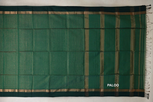 Bottle green Maheshwari silk cotton saree laid flat, showing a striped pallu with tassels and dark bottle green borders with gold bands.