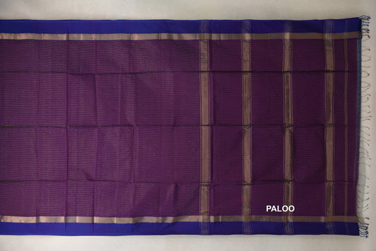 Spread Maheshwari silk cotton saree with a deep purple body, violet purple borders, and a striped pallu with tassels at the end.