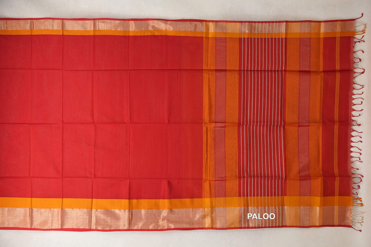 Maheshwari silk cotton saree spread flat, with a plain tomato red body, deep orange borders and a striped Multi Color pallu with tassels.