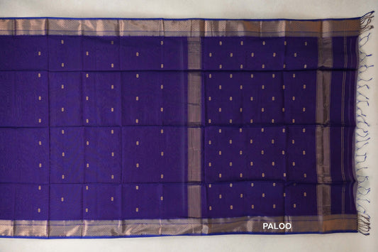 Royal Purple Maheshwari silk cotton saree spread out, with small gold-toned motifs, patterned borders and a tasseled pallu at the right.