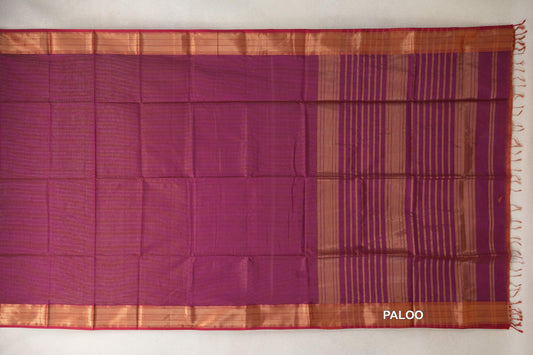 Deep Magenta Maheshwari silk cotton saree laid flat, showing a plain body, striped pallu, shimmering borders with Rani Pink edges, and tassels.