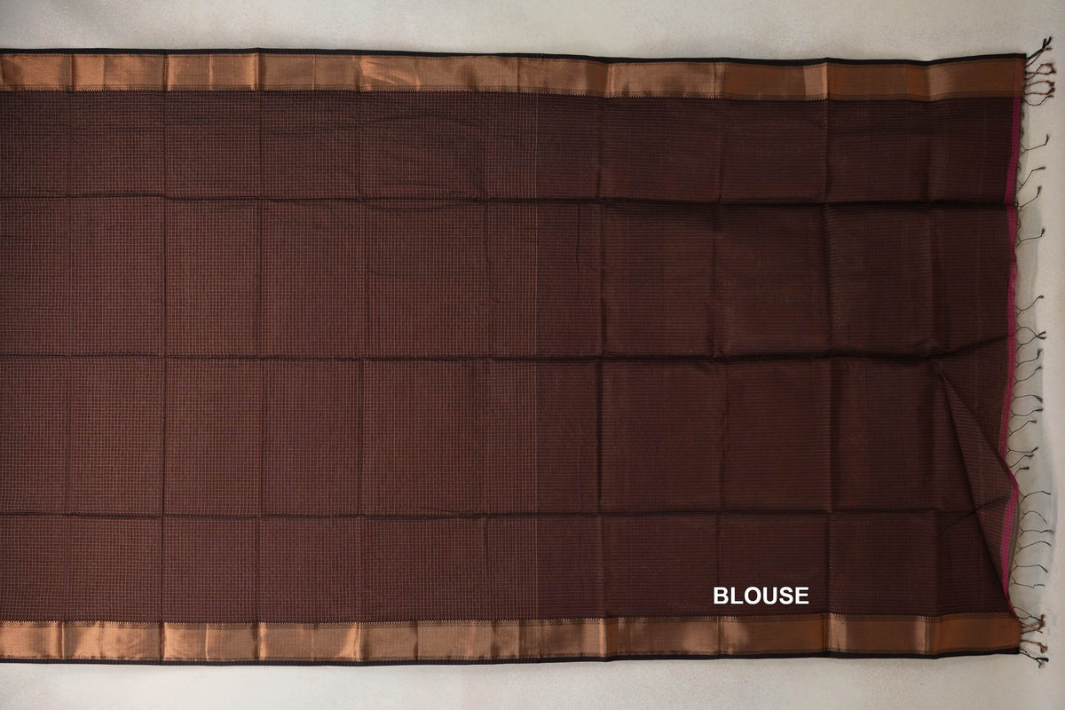 Coffee Brown Maheshwari silk cotton saree laid flat, showing a fine grid, coffee brown borders with deep brown edges, and a tasseled blouse section.