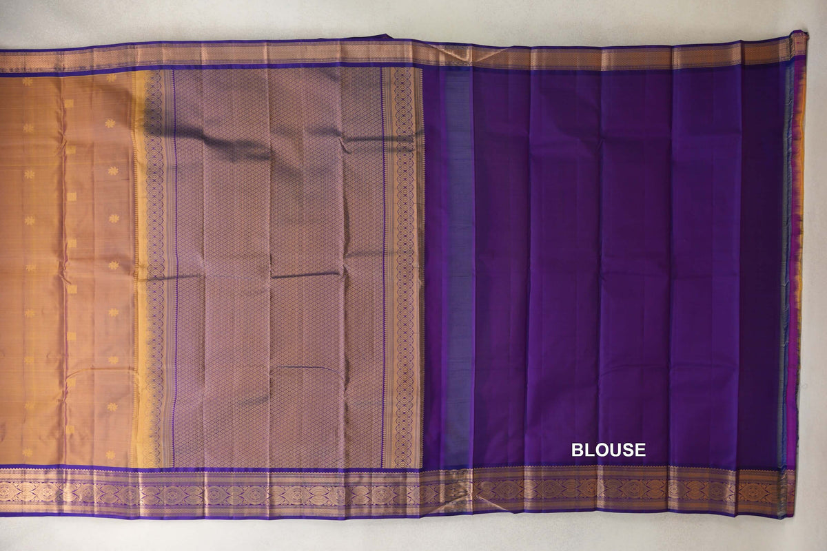 Laid-out lightweight Kanchipuram silk saree with a yellow body, small motifs, a lattice-patterned pallu, violet purple borders and a blouse piece.