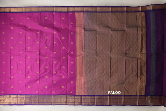 Lightweight Kanchipuram silk saree spread out, showing a deep magenta body with small gold motifs, a violet purple lattice-patterned pallu and ornate gold borders.
