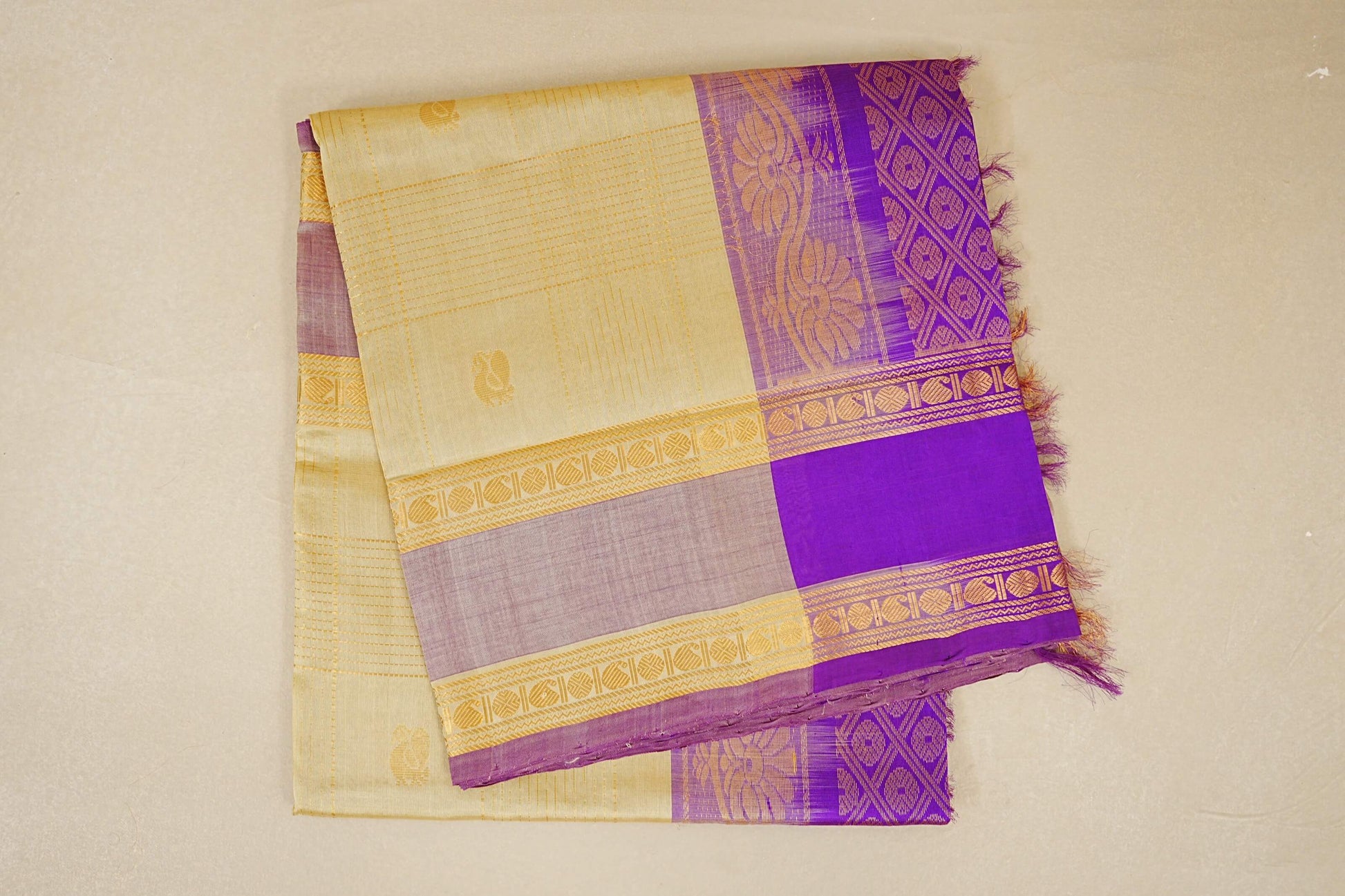 folded Cream with Dual Tone Cream and Purple Borders Silk Cotton Saree