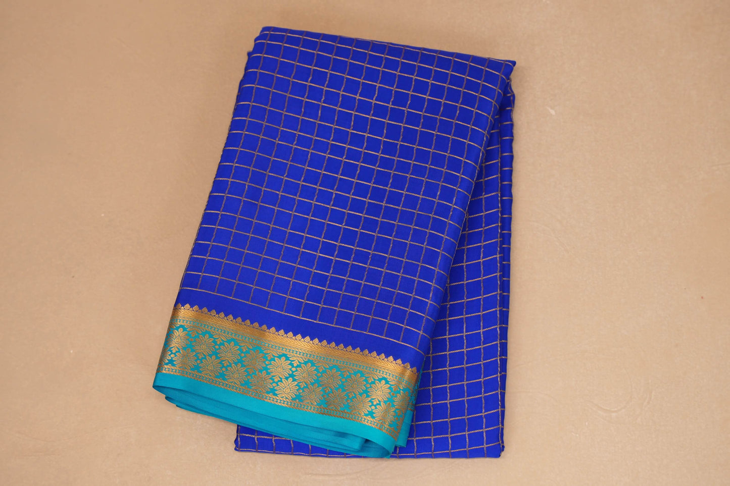 folded royal blue mysore silk saree