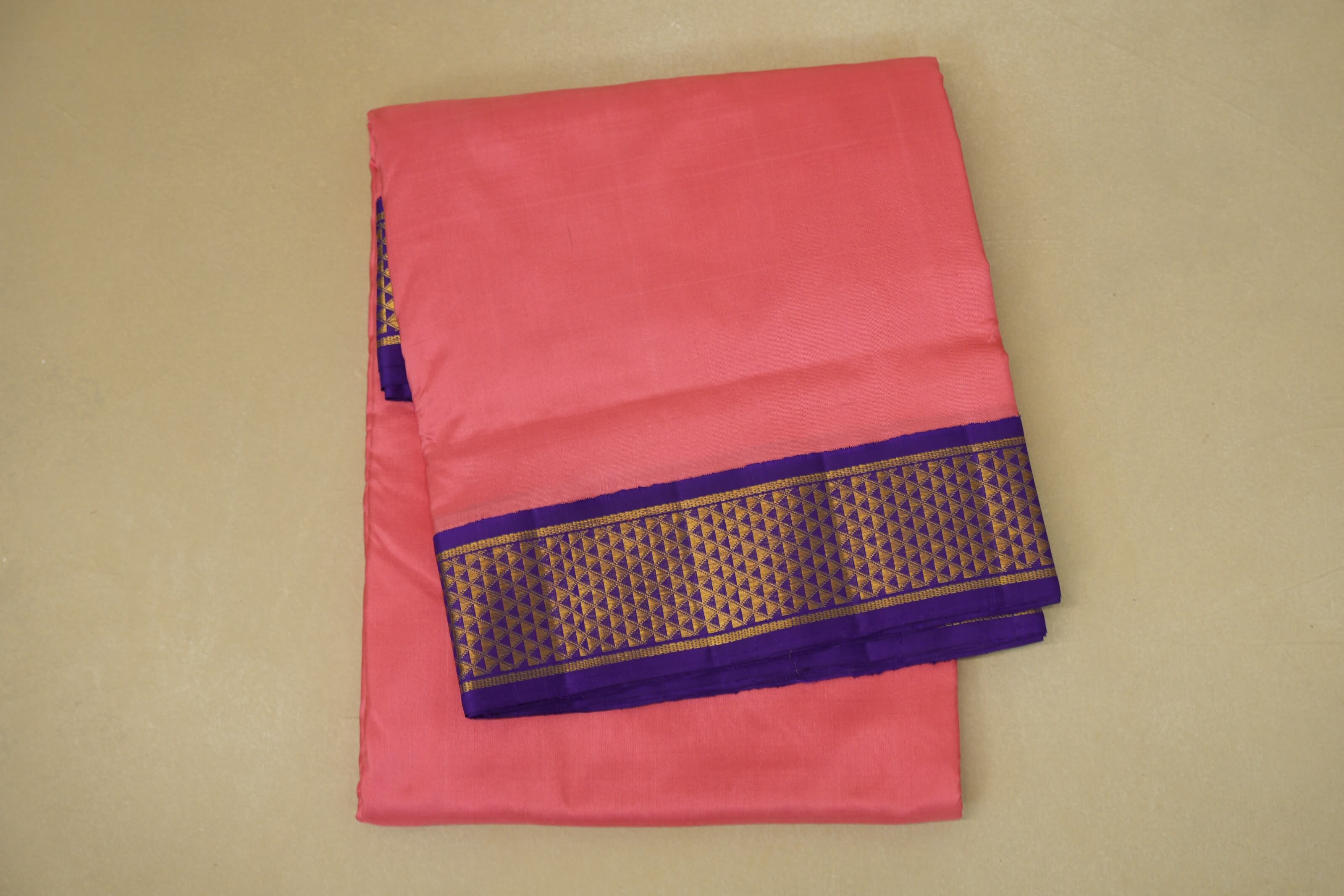 folded peach pink ten yards silk saree 