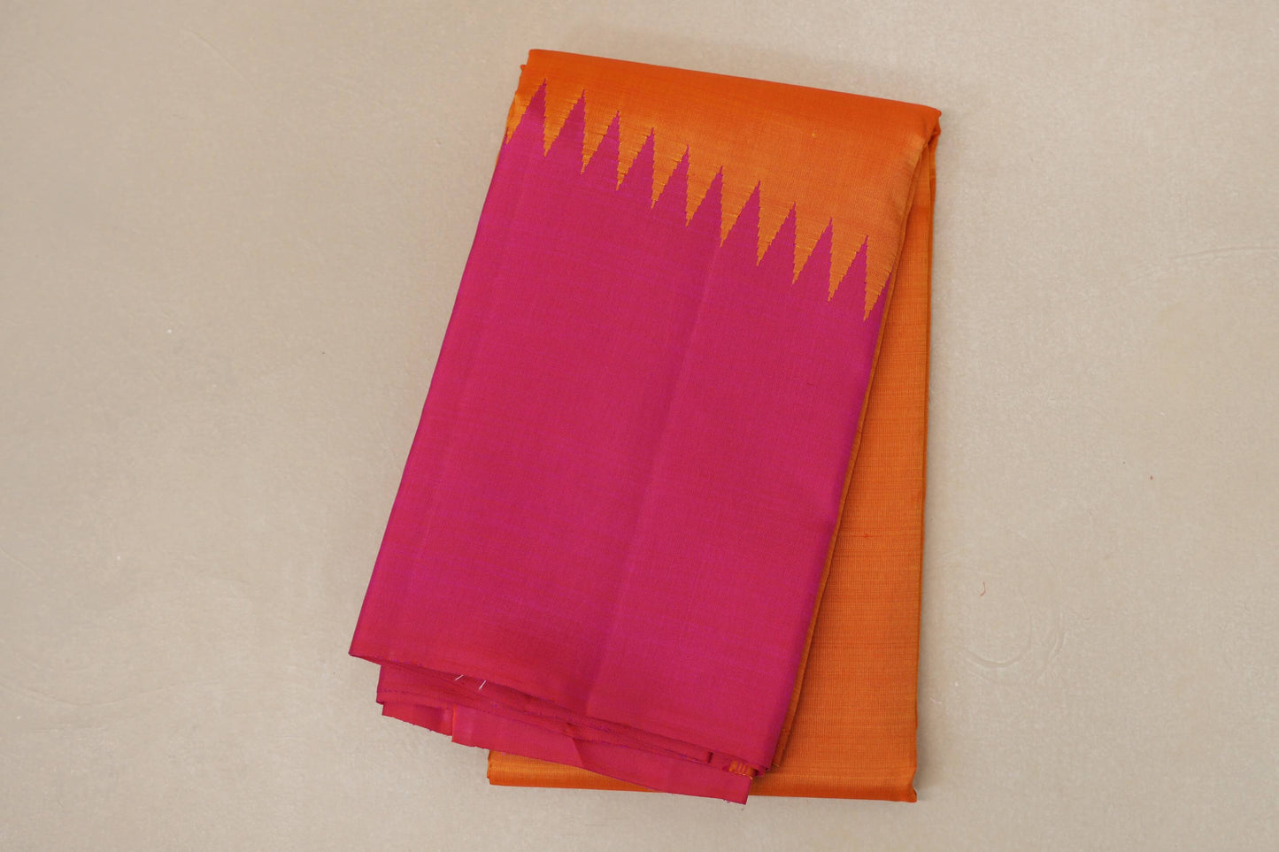 folded Reddish Orange with Bright Pink Borders Vintage Kanjivaram Silk Saree 