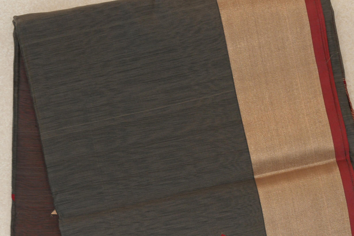 Folded charcoal grey Maheshwari silk-cotton saree showing a finely striped body, broad beige band and deep red selvedge along the edge.