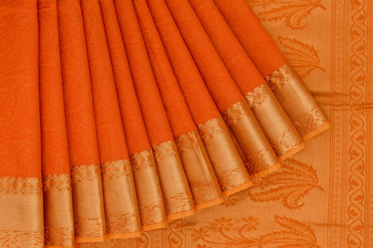 silk cotton saree with orange body and mustard border, featuring floral details on the border.
